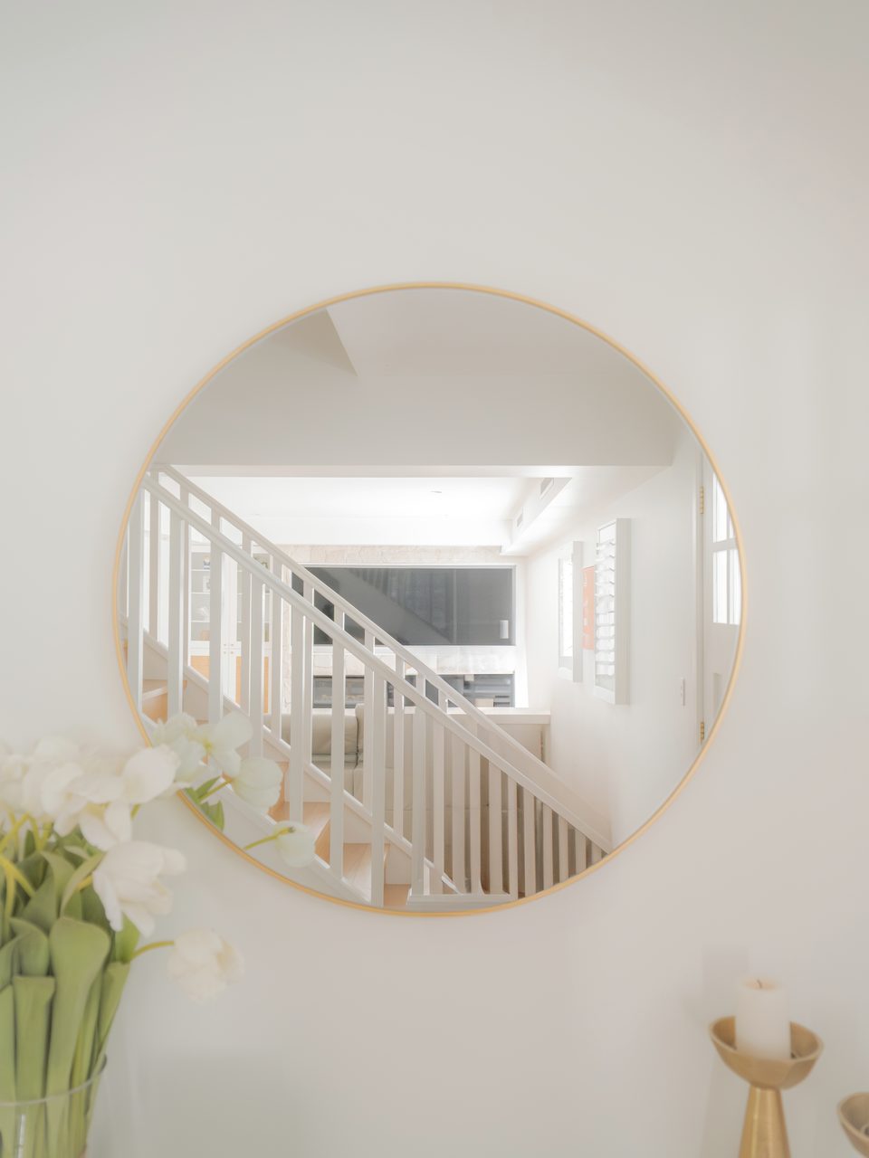 The stair, seen in the hall mirror