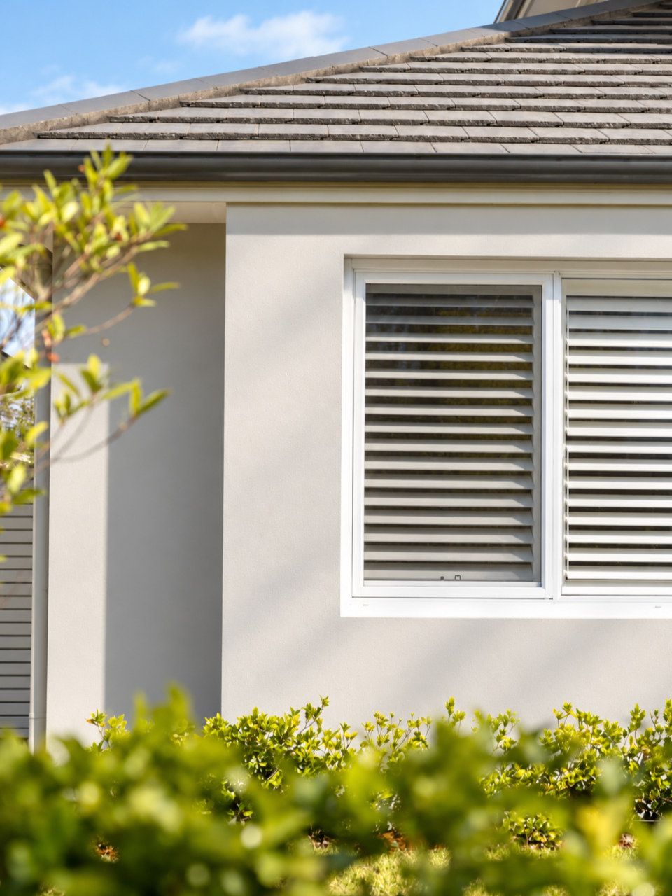 A shuttered window under the gable