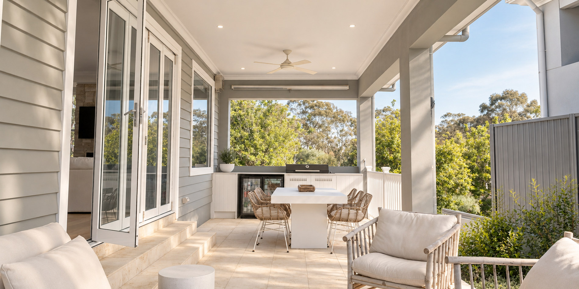 Covered alfresco with the outdoor kitchen, looking out to the trees